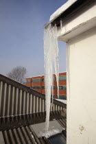 Weather, Winter, Ice, Large Icicle hanging from roof gutters.