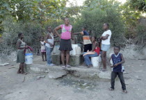 Haiti, La Gonave island, Children using water pump provided by the Scottish Charity LemonAid clean water program.