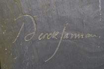 England, Kent, Romney Marsh, Old Romney, Detail of Derek Jarman's modern headstone the graveyard of St Clements church.