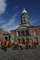 Ireland, Dublin, Performers wearing jester costumes in upper yard of Dublin Castle.
