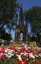 Scotland, Lothian, Edinburgh, Scott monument in Princes street with flower beds in the foreground.