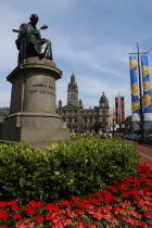 Scotland, Strathclyde, Glasgow, City centre with James Watt Statue and surrounding flower beds.