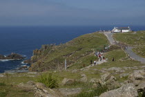 England, Cornwall, Lands End, View over the most western point of mainland Britain with visitors making their way along coast path.