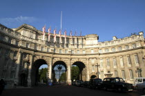 England, London, Admiralty Arch, designed in 1911 by Ashton Webb as part of a processional route to honour Queen Victoria.