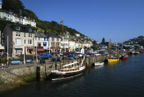England, Cornwall, Looe, Moored boats along the harbour waterfront.