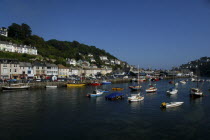 England, Cornwall, Looe, Moored boats along the harbour waterfront.