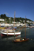 England, Cornwall, Looe, Moored boats along the harbour waterfront.