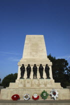 England, London, St James Park, Horse Guards Parade, Guards Memorial with wreaths at base.