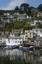 England, Cornwall, Polperro, Watefront houses and harbour.