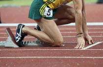 India, Delhi, 2010 Commonwealth games, Track event runner on his starting blocks.