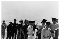 Bolivia, Santa Cruz, Vallegrande, Cuban born CIA Agent Gustavo Villoldo on early morning inspection of Vallegrande airstrip with Bolivian soldiers, clearly aware that he is being photographed. Monday...