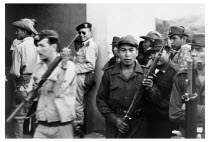 Bolivia, Santa Cruz, Vallegrande, Bolivian rangers guard entrance to laundry room at local Vallegrande hospital where the body of Che Guevara had been taken for inspection by Bolivian doctors. Monday...