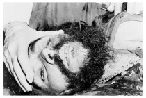 Bolivia, Santa Cruz, Vallegrande, Bloodstained head and body of Che Guevara being inspected by Bolivian doctors in laundry room of the local Vallegrand hospital, late afternoon Monday 09 October 1967.