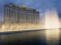 USA, Nevada, Las Vegas, Bellagio hotel and casino on the strip with fountain display in the foreground.