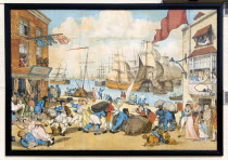 England, Hampshire, Portsmouth, The Camber in Old Portsmouth showing the Bridge Tavern with a mural by Thomas Rowlanson of his cartoon entitled Portsmouth Point.