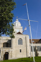 ENGLAND, Hampshire, Portsmouth, The Anglican Cathedral Church of St Thomas of Canterbury started in the 12th Century consecrated in 1927 and completed in 1980 with a flagpole in foreground.