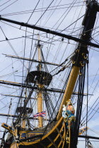 ENGLAND, Hampshire, Portsmouth, Bow and rigging of Admiral Lord Nelson's flagship HMS Victory showing the ship's figurehead in the Historic Naval Dockyard.