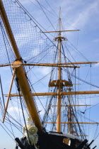 England, Hampshire, Portsmouth, Historic Naval Dockyard Figurehead masts and rigging of HMS Warrior built in 1860 as the first iron hulled sail and steam powered warship.