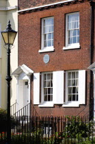 England, Hampshire, Portsmouth, The Charles Dickens Birthplace Museum in Old Commercial Road where he was born in 1812 and lived for three years commemorated with a blue plaque.