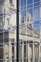 England, Hampshire, Portsmouth, Guildhall reflected in nearby glass oCivic Office building. Originally built in 1890 but rebuilt in 1959 after being bombed in 1941 during World War II.