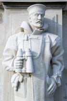 ENGLAND, Hampshire, Portsmouth, World War Two Naval memorial on Southsea seafront designed by Sir Edmund Maufe with sculpture by Sir Charles Wheeler of a sailor holding a pair of binoculars.