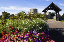 ENGLAND, Hampshire, Portsmouth, Portchester Castle The 12th Century Norman tower and 14th Century Keep in the old Roman 3rd Century Saxon Shore Fort seen from the grounds of the Norman Ausgustine Prio...