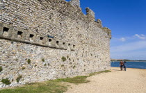 England, Hampshire, Portsmouth, Portchester Castle Norman 12th Century flint walls rebuilt on the site of the Roman 3rd Century Saxon Shore Fort with the garderobe chutes or toilets from the Augustine...