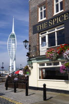 ENGLAND, Hampshire, Portsmouth, Harbour wth the 170 metre tall Spinnaker Tower seen from the Spice Island Inn public house.