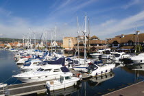 ENGLAND, Hampshire, Portsmouth, Port Solent with boats moored with restaurants a pub and housing surrounding the Marina.