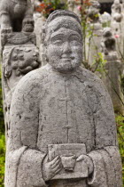 China, Shaanxi Province, Xian, Carved statue of a man in Small Goose Pagoda Park.