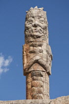 China, Yunnan Province, Lijiang, Naxi tribe stone carving at cable car station, at base of Yulong Xue Shan Mountain.