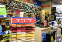 England, West Sussex, Chichester, Ryman's office staionery store with two female shop assistants behind counter.