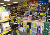 England, West Sussex, Chichester, Ryman's office staionery store with two female shop assistants behind counter.