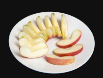 Food, Fruit, Apples, Slices of ripe apple on a white plate.