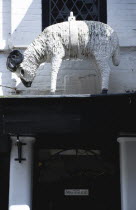 England, Wiltshire, Salisbury, Old figure of white ram that was used as a hanging pub sign.