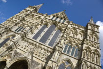 England, Wiltshire, Salisbury, The West Front main entrance of the 13th Century Early English Gothic Cathedral Church of the Blessed Virgin Mary with the tallest spire in Britain. The statues conform...