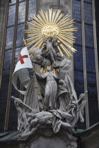 Austria, Vienna, Statue on the outside of Stephansdom Cathedral, pulpit of John Capistrano 18th century statue of St Francis beneath a sunburst standing on a beaten Turk.