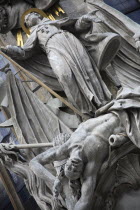 Austria, Vienna, Statue on the outside of Stephansdom Cathedral, pulpit of John Capistrano 18th century statue of St Francis beneath a sunburst standing on a beaten Turk.