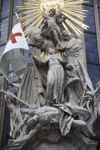 Austria, Vienna, Statue on the outside of Stephansdom Cathedral, pulpit of John Capistrano 18th century statue of St Francis beneath a sunburst standing on a beaten Turk.