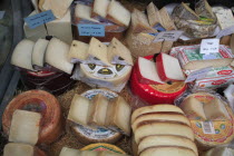 Austria, Vienna, Display of cheeses in the Naschmarkt.