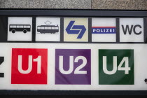 Austria, Vienna, Sign for the metro, tram, buses, police and toilets.