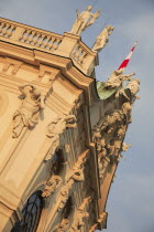 Austria, Vienna, Belvedere Palace, Detail of roof statues and carvings on the exterior facade.