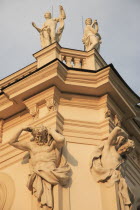 Austria, Vienna, Belvedere Palace, Detail of roof statues and carvings on the exterior facade.