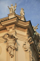 Austria, Vienna, Belvedere Palace, Detail of roof statues and carvings on the exterior facade.