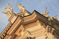 Austria, Vienna, Belvedere Palace, Detail of roof statues and carvings on the exterior facade.