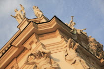 Austria, Vienna, Belvedere Palace, Detail of roof statues and carvings on the exterior facade.