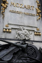 Austria, Vienna, Detail at the base of the statue of Mozart in the Burggarten.