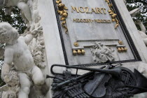 Austria, Vienna, Detail at the base of the statue of Mozart in the Burggarten.