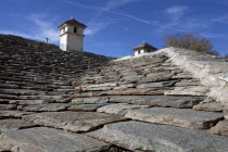 Greece, Macedonia, Pilio, Portaria, Greek village house traditional roof with chimneys made from stone.