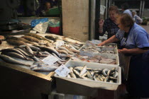 Portugal, Lisbon, Vendor and display of fish in the Ribeira market.